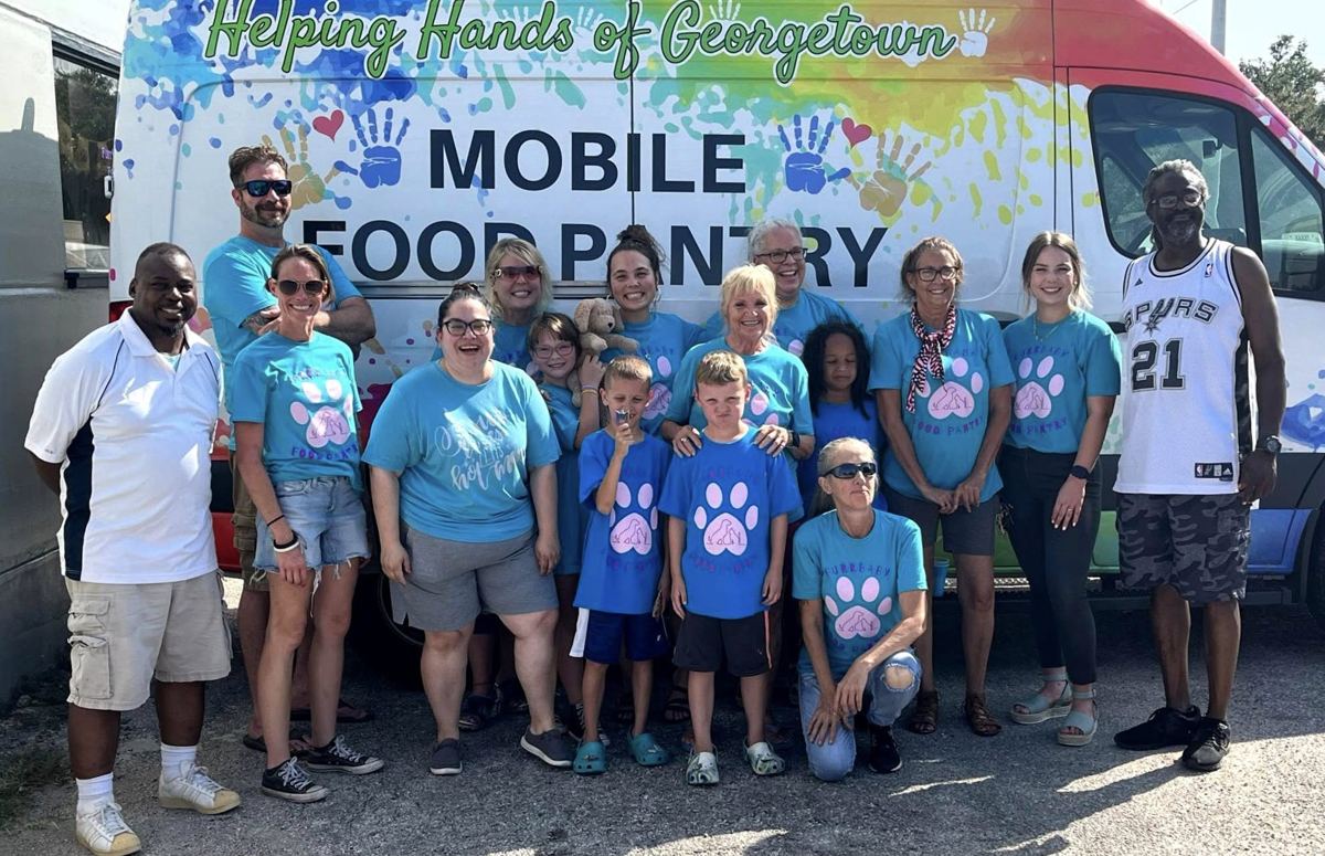 Volunteers with the Mobile Food Pantry van at a pop-up pantry