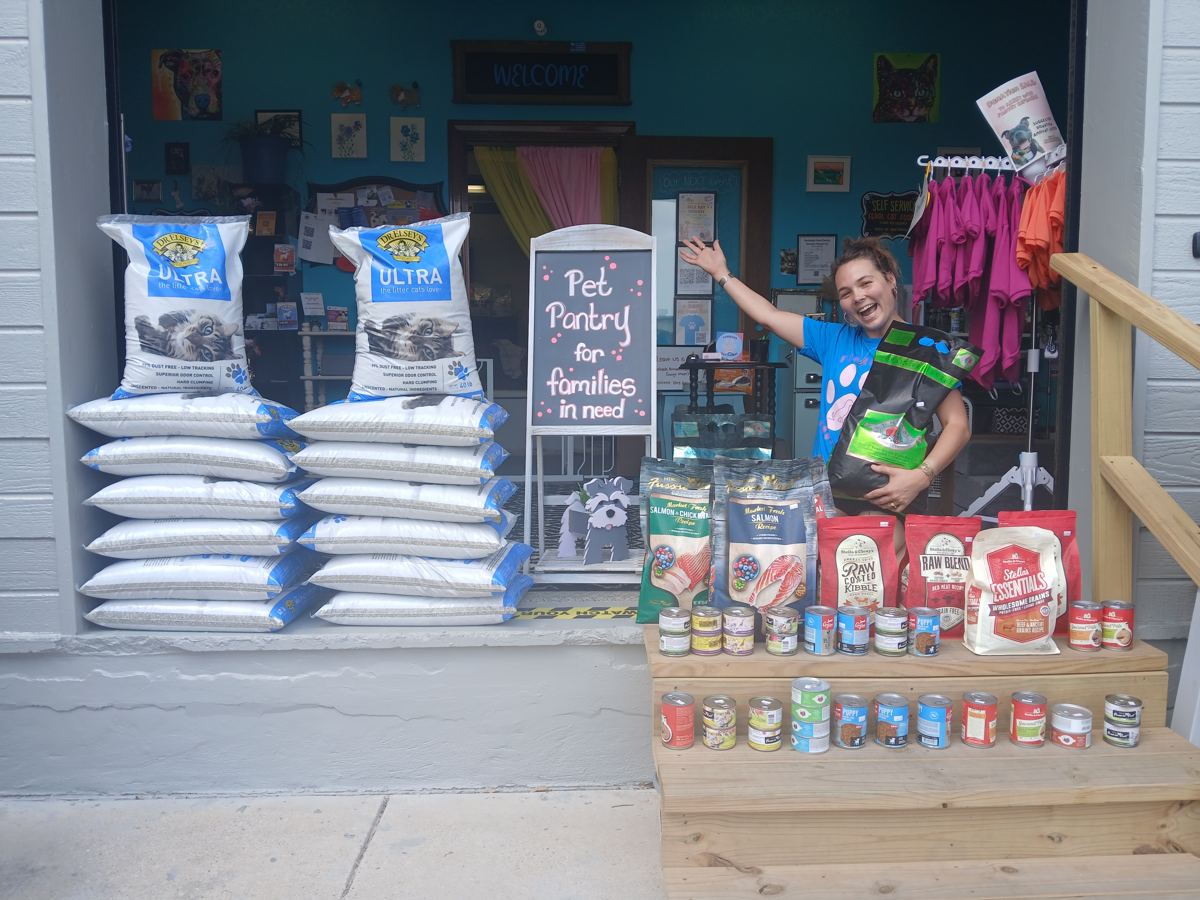 Pallets of donated pet food outside the pantry storefront